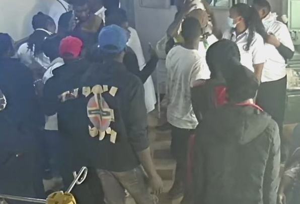 People camp outside Eagle Nursing Home in Kangemi, demanding release bodies of shot victims during Saba Saba protest.